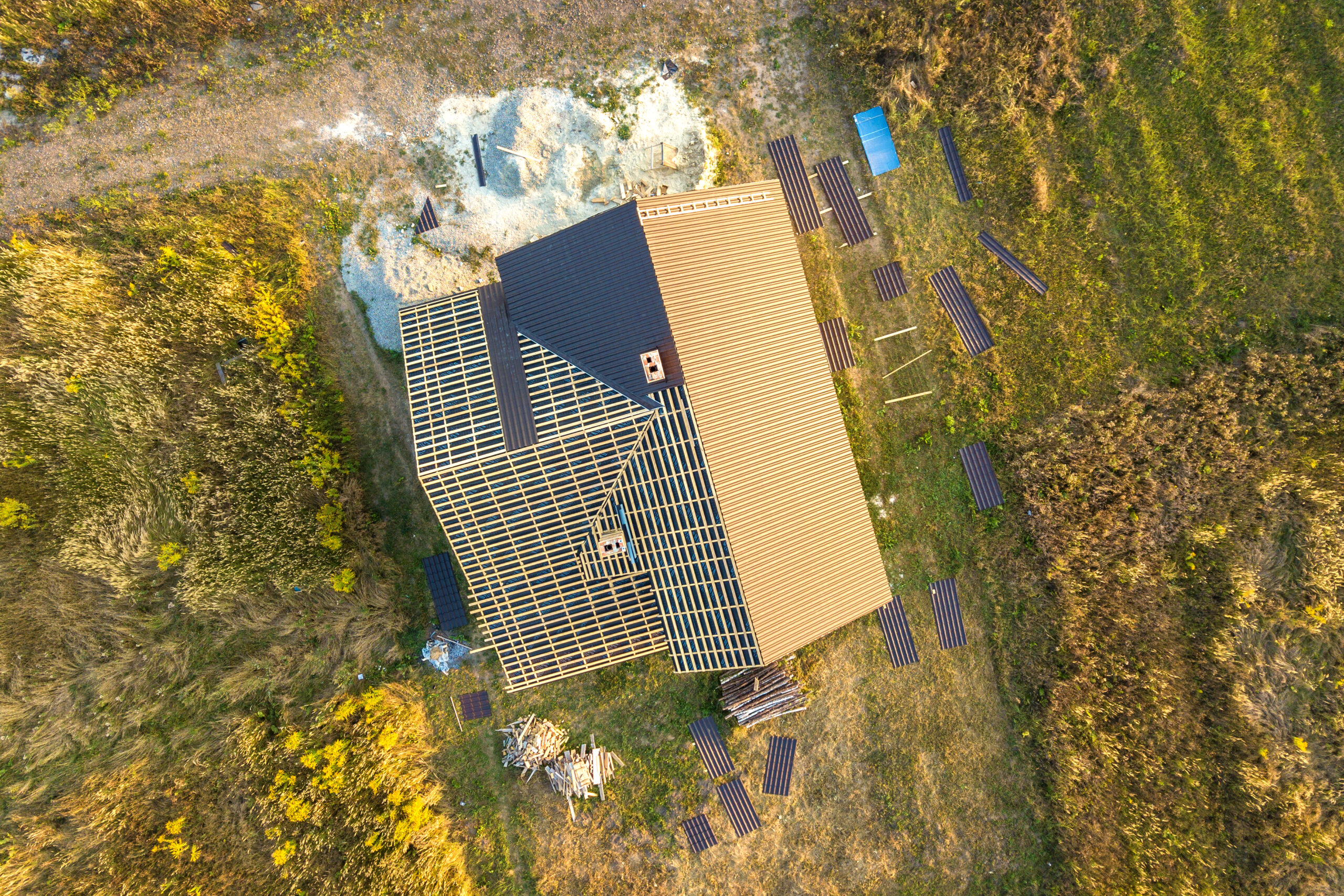 unfinished house with a metal roof